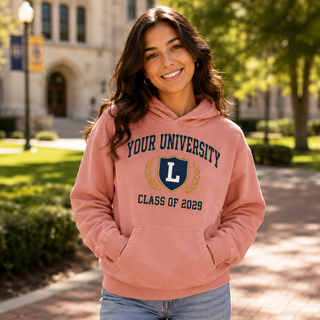 College student wearing custom university pink hoodie on campus